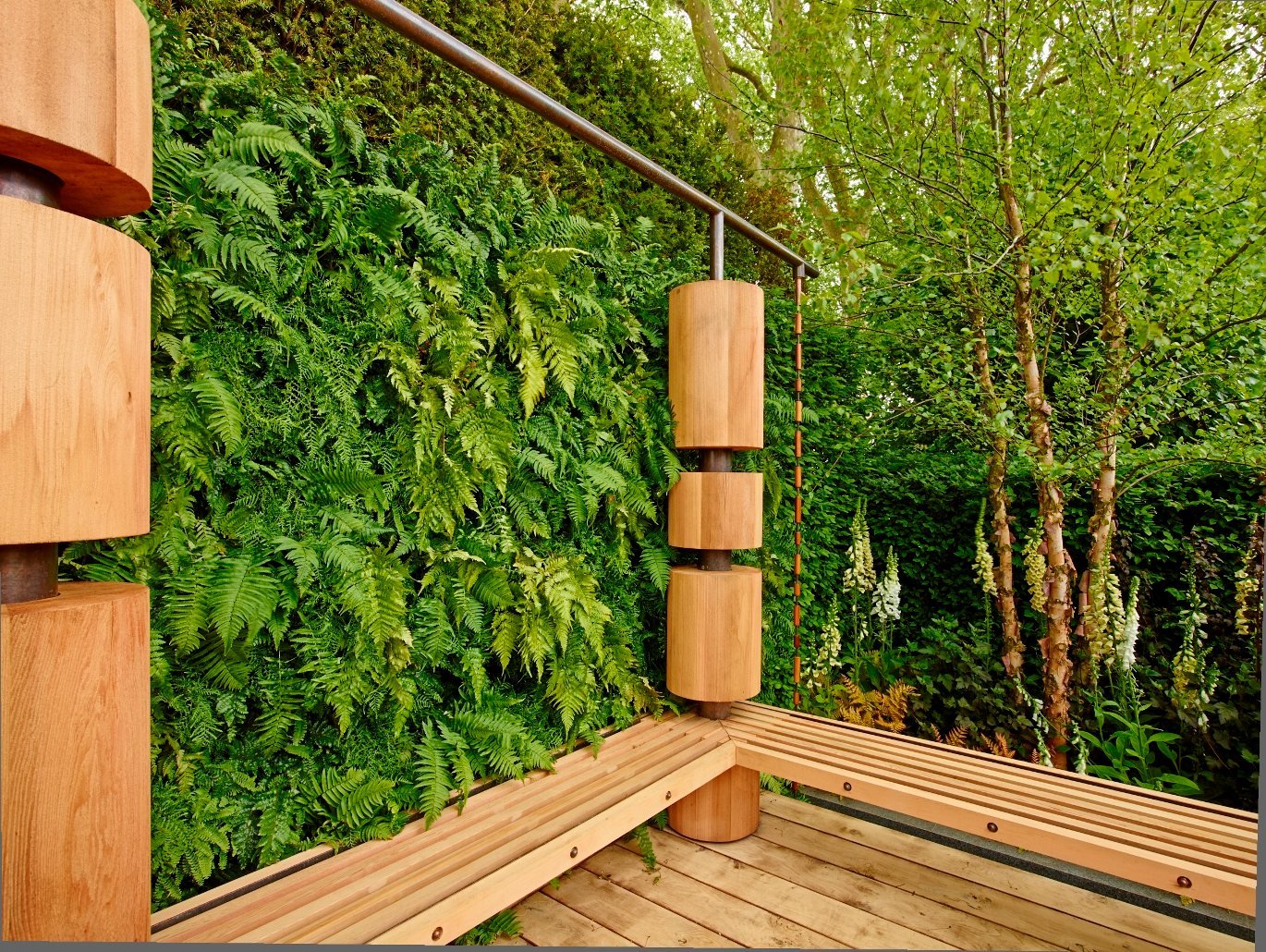 Detail of a Living Louvres planted fin standing off the building line beside a timber bench