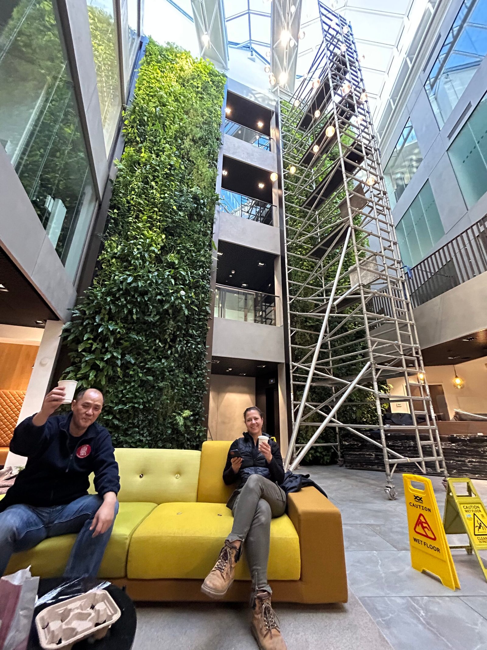 Life on Walls team reviewing a living wall project on site in Bristol